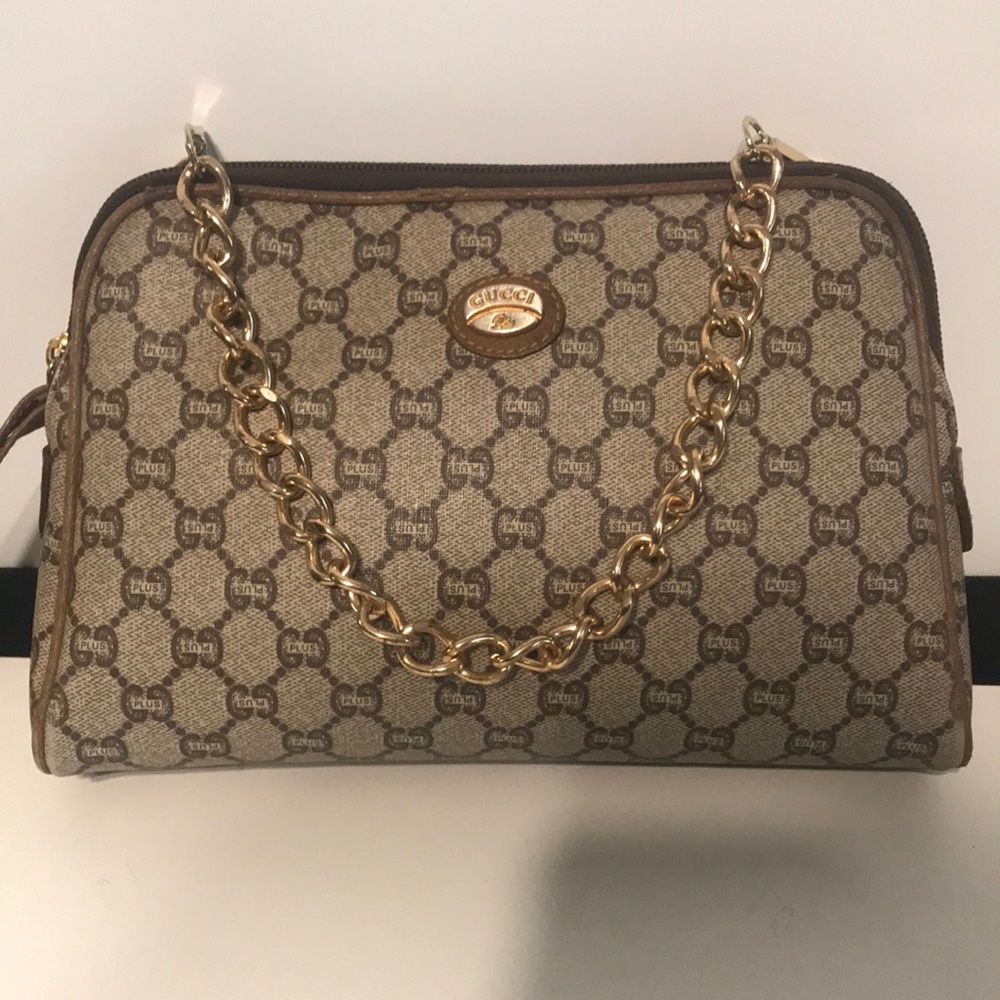 Gucci Plus Monogram vintage clutch bag with removable gold chain.